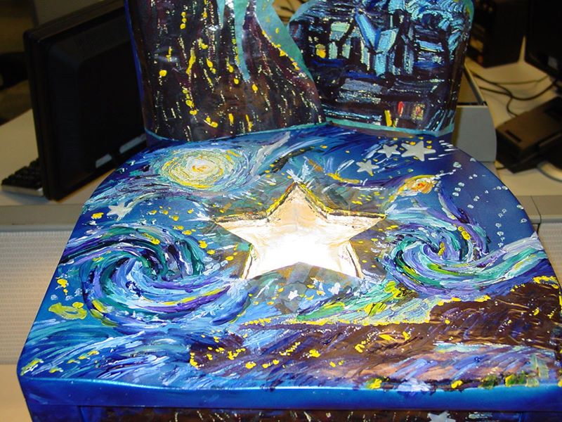 Painted chair with lit underside.